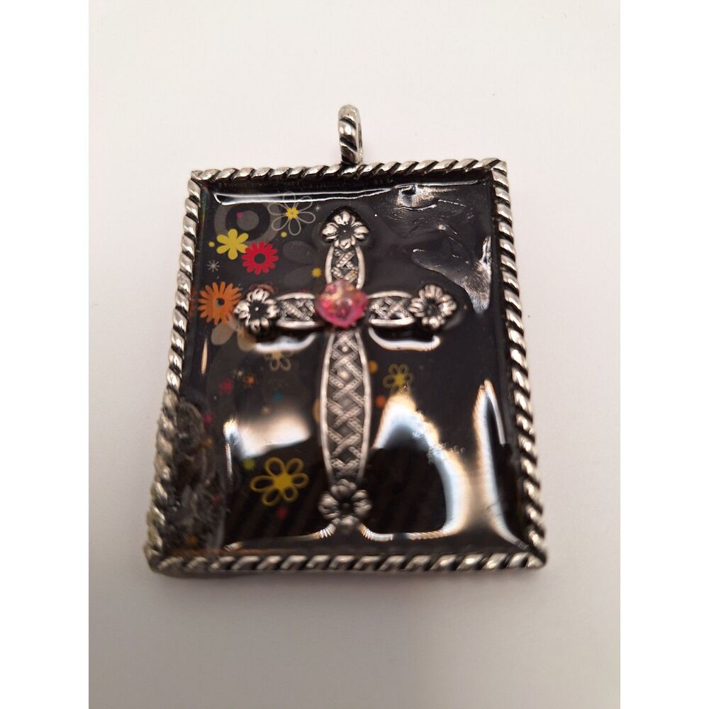 Cross pendant enamel flowers square black background rope trim in silver tone